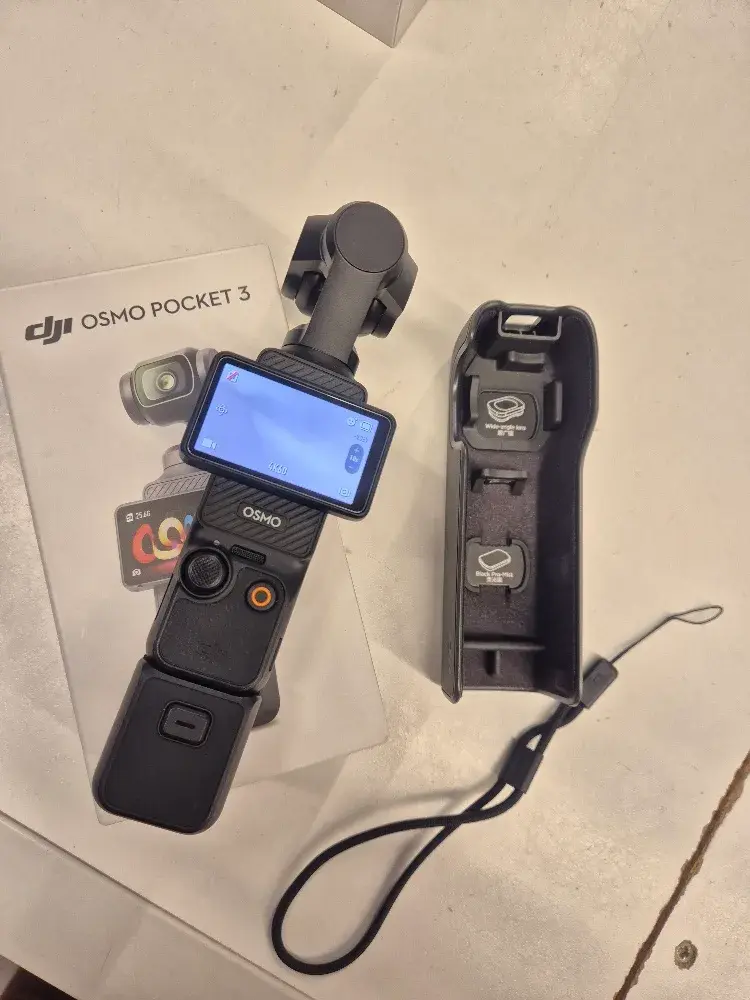 DJI Osmo Pocket 3 handheld gimbal vlogging camera, main view of the camera and gimbal, sold by PHYX