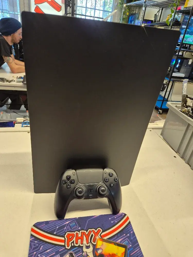 PlayStation 5 disc console with controller, view 1 of 5