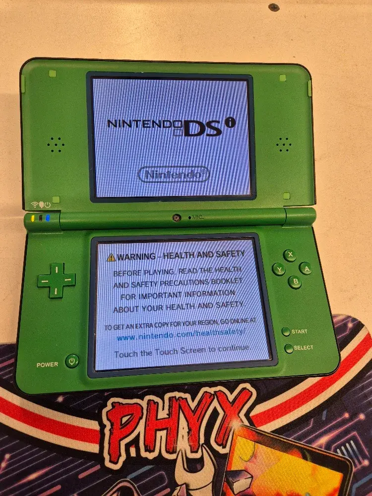 Nintendo DSi XL handheld game console, green, view 1 of 11