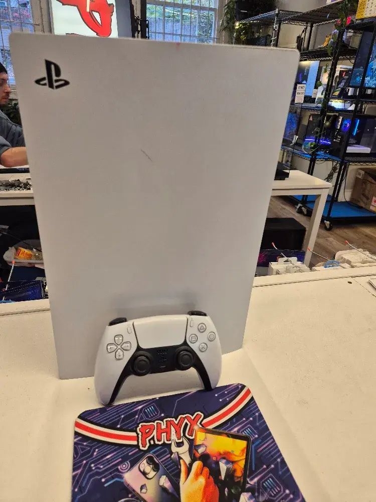 PlayStation 5 disc console with controller, view 1 of 5