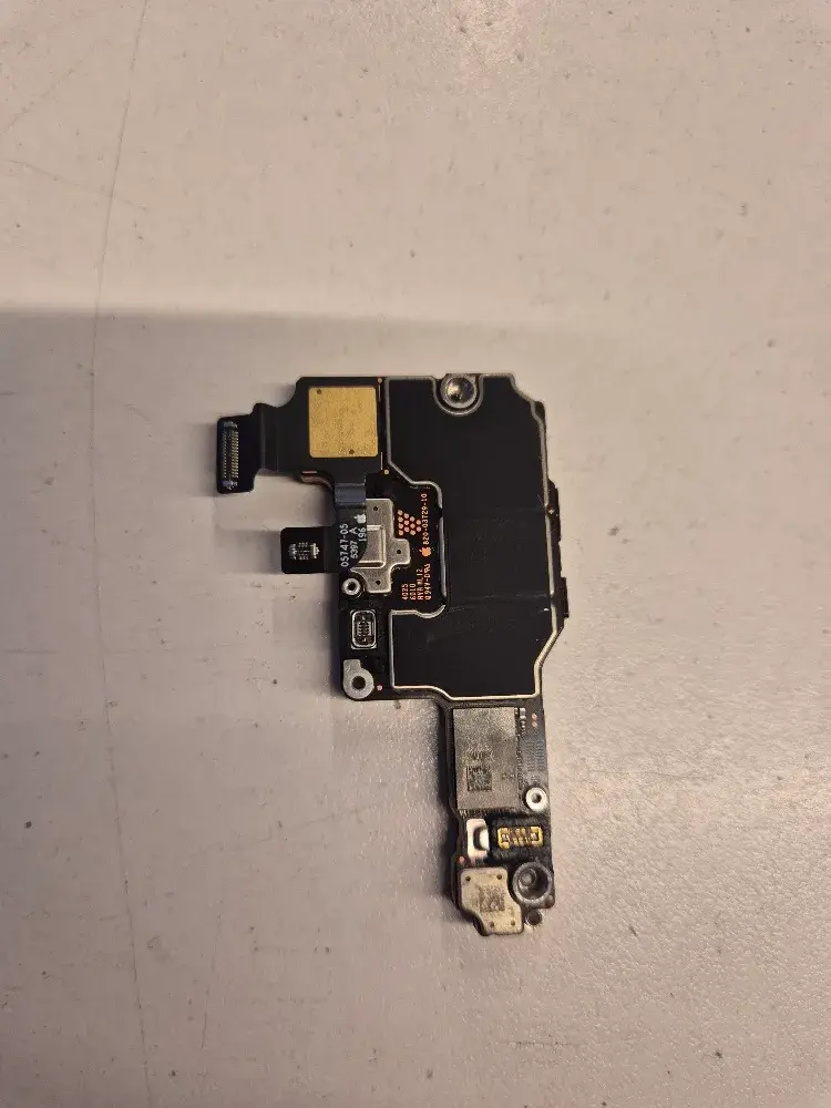 The other side of the same stacked iPhone logic board, with its shields and flex cables