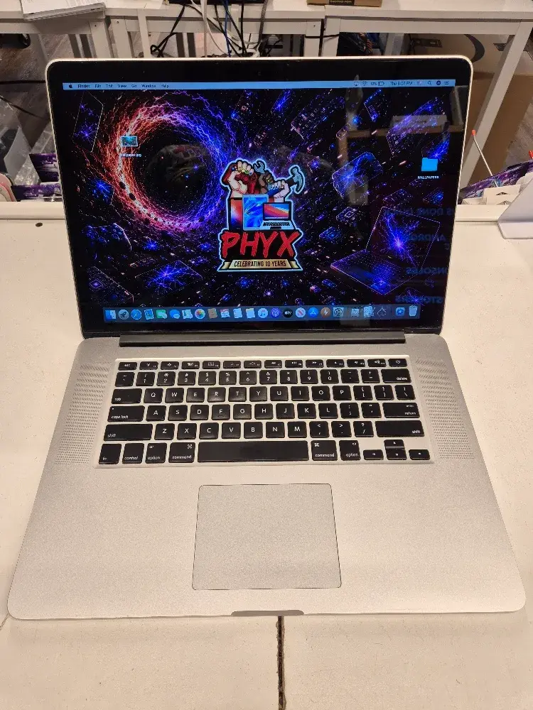 Apple MacBook Pro 2014, 15 inch Retina laptop with a new battery, used condition, view 1 of 8