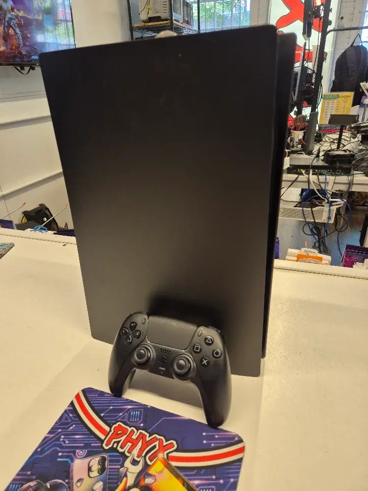 PlayStation 5 disc console with controller, view 1 of 5